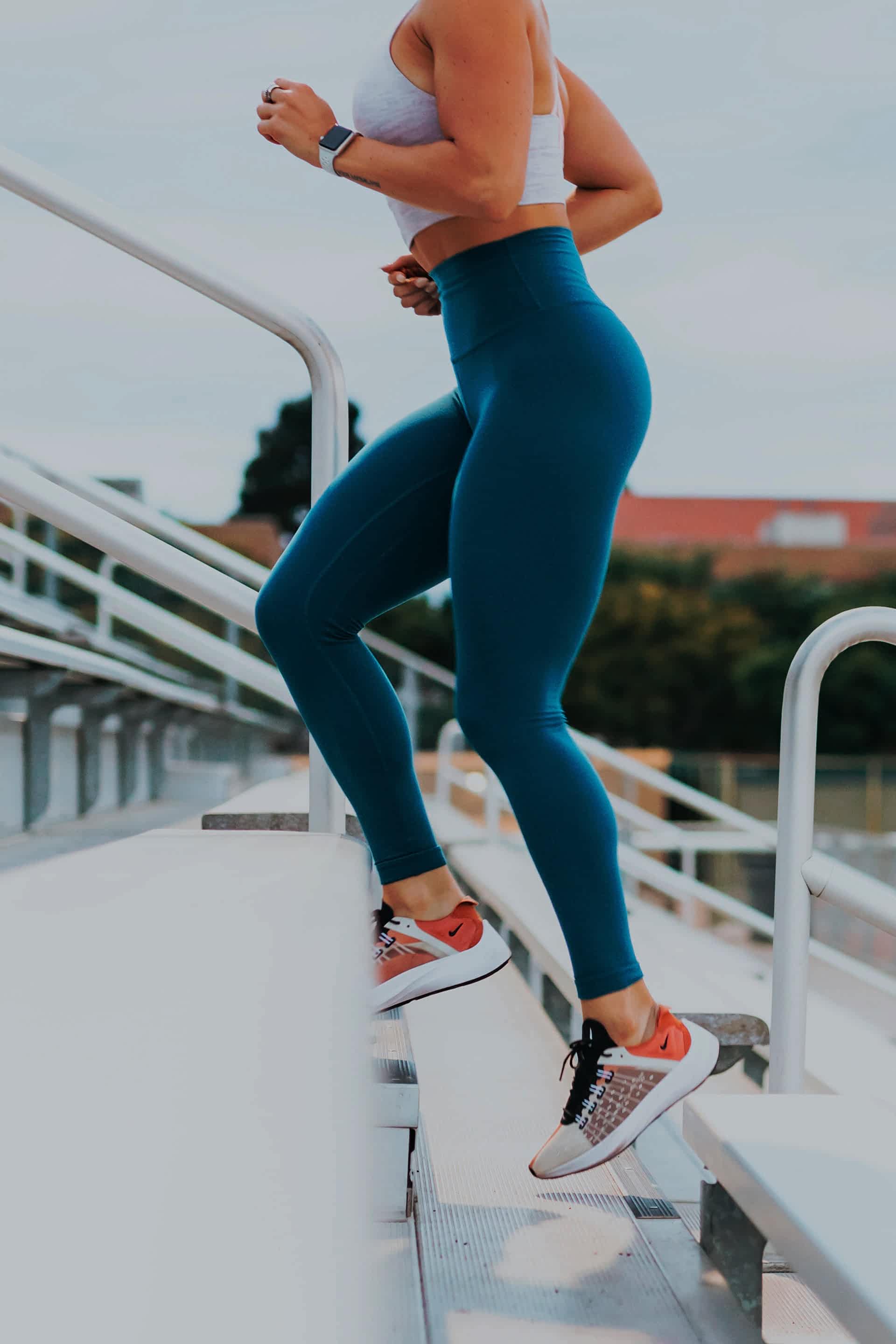 Fitness Girl Climping stadium stairs
